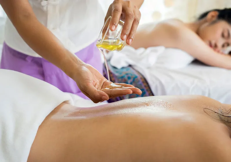 Couples massage room with two tables and romantic lighting